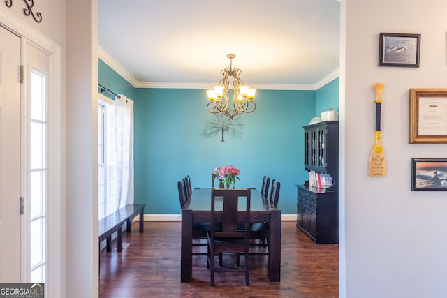 dining room featuring crown molding, baseboards, a chandelier, and dark wood-style floors