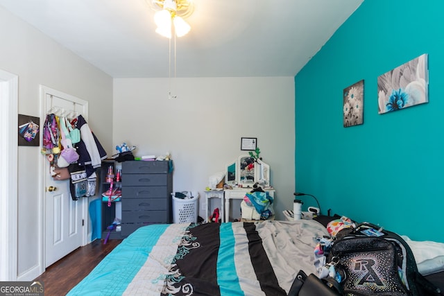 bedroom featuring dark wood finished floors
