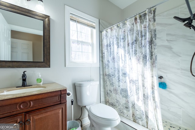 1036 Regency Park Dr, Braselton, GA 30517 - bathroom featuring vanity, toilet, and tiled shower