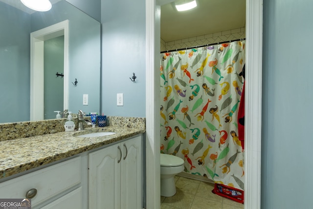 bathroom featuring vanity, a shower with curtain, and toilet