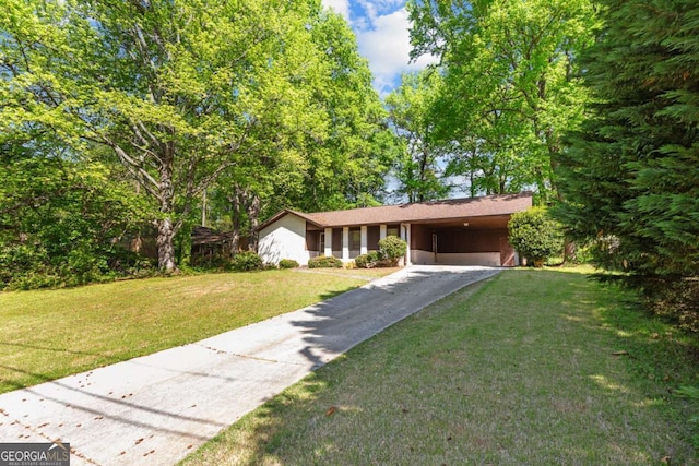 3944 Woburn Dr, Tucker, GA 30084 - ranch-style home with driveway, an attached carport, and a front lawn