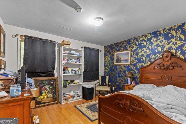 3944 Woburn Dr, Tucker, GA 30084 - bedroom featuring wallpapered walls and wood finished floors