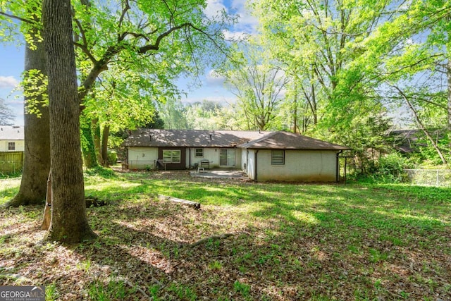 3944 Woburn Dr, Tucker, GA 30084 - rear view of property featuring a yard, a patio area, and fence