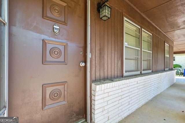 3944 Woburn Dr, Tucker, GA 30084 - view of exterior entry featuring a porch and brick siding