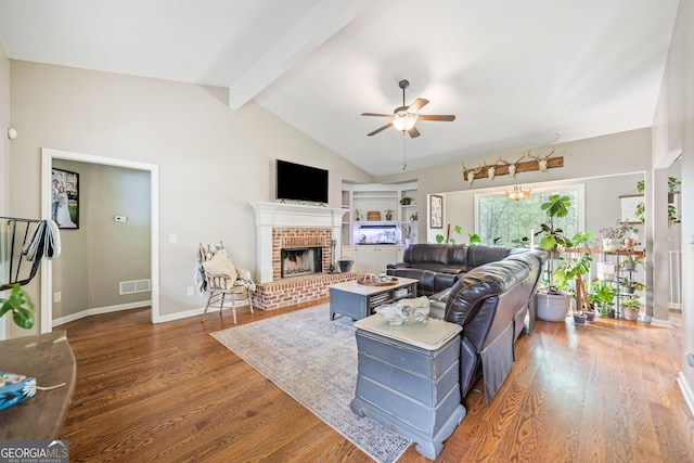524 Allison Ln, Ball Ground, GA 30107 - living area featuring a ceiling fan, wood finished floors, and a brick fireplace