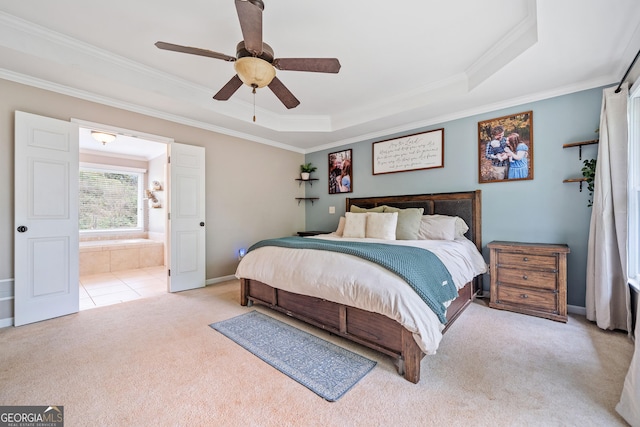 524 Allison Ln, Ball Ground, GA 30107 - carpeted bedroom featuring ornamental molding, a raised ceiling, ensuite bathroom, and ceiling fan