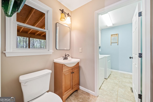 524 Allison Ln, Ball Ground, GA 30107 - bathroom featuring washing machine and dryer, vanity, and tile patterned flooring