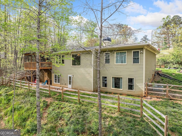 524 Allison Ln, Ball Ground, GA 30107 - rear view of house featuring a wooden deck, a chimney, a fenced backyard, and stairway