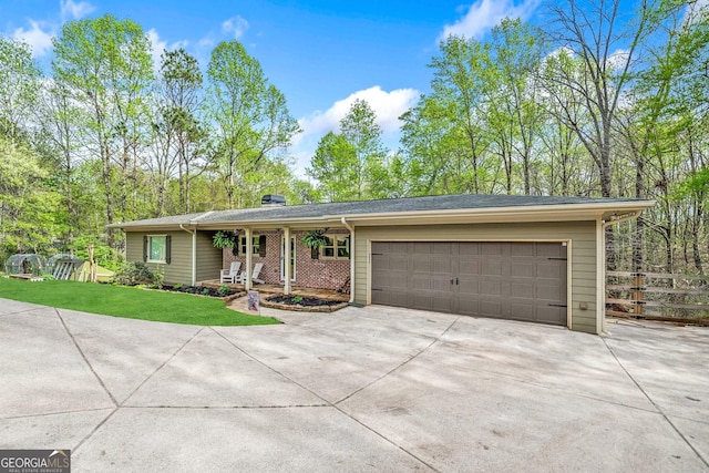 524 Allison Ln, Ball Ground, GA 30107 - ranch-style house with concrete driveway and an attached garage