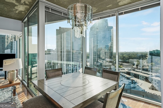 3324 Peachtree Rd NE Unit 1518, Atlanta, GA 30326 - sunroom / solarium with plenty of natural light, a view of city, and an inviting chandelier