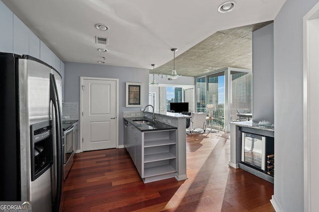 3324 Peachtree Rd NE Unit 1518, Atlanta, GA 30326 - kitchen featuring a peninsula, open shelves, visible vents, appliances with stainless steel finishes, and a sink