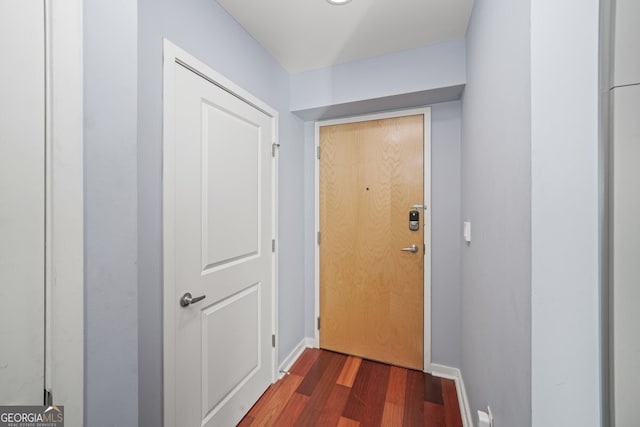3324 Peachtree Rd NE Unit 1518, Atlanta, GA 30326 - doorway with baseboards and wood finished floors