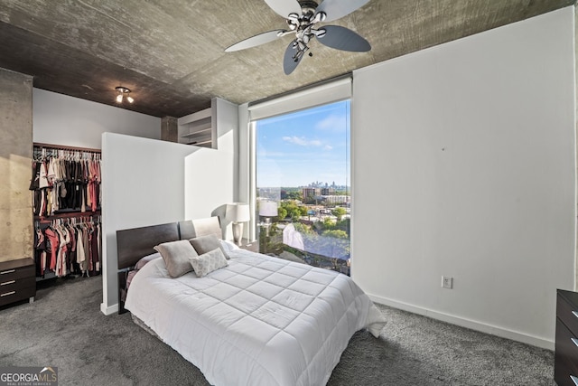 3324 Peachtree Rd NE Unit 1518, Atlanta, GA 30326 - bedroom featuring a walk in closet, carpet, a closet, and baseboards