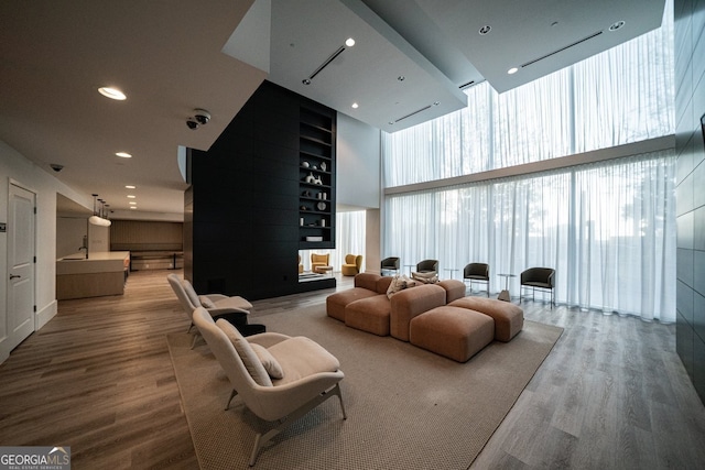 3324 Peachtree Rd NE Unit 1518, Atlanta, GA 30326 - home theater featuring wood finished floors, a high ceiling, and recessed lighting