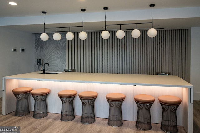 3324 Peachtree Rd NE Unit 1518, Atlanta, GA 30326 - bar with a sink, recessed lighting, decorative light fixtures, and wood finished floors