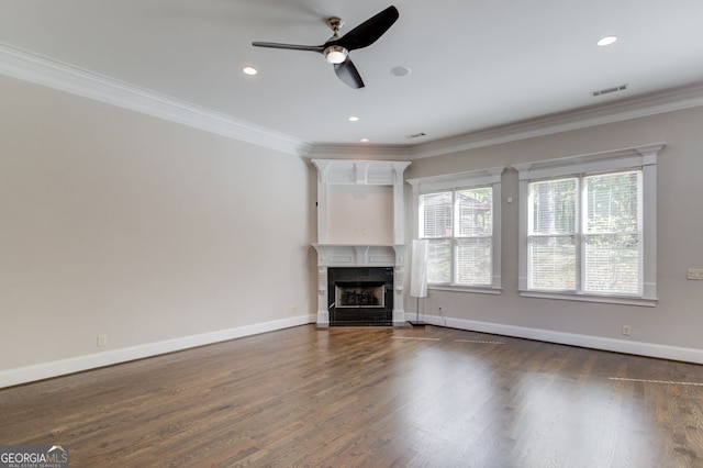 476 Walnut Rd, Hoschton, GA 30548 - unfurnished living room featuring crown molding, plenty of natural light, a fireplace, ceiling fan, and dark wood finished floors