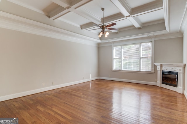 476 Walnut Rd, Hoschton, GA 30548 - unfurnished living room featuring coffered ceiling, a ceiling fan, a glass covered fireplace, wood finished floors, and beamed ceiling