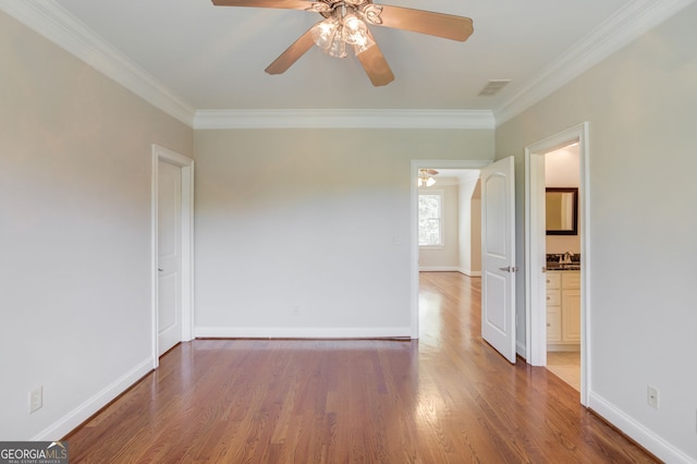 476 Walnut Rd, Hoschton, GA 30548 - spare room featuring crown molding, a ceiling fan, and wood finished floors