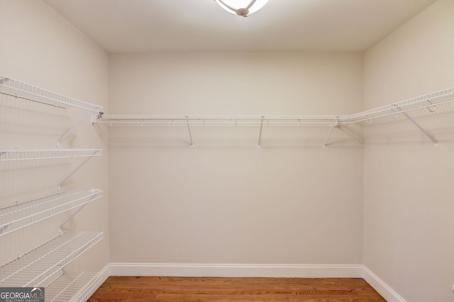 476 Walnut Rd, Hoschton, GA 30548 - walk in closet with wood finished floors