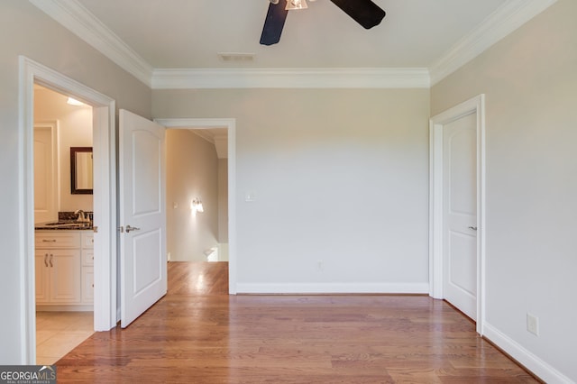 476 Walnut Rd, Hoschton, GA 30548 - unfurnished room with ceiling fan, ornamental molding, and light wood-style flooring