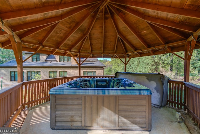 476 Walnut Rd, Hoschton, GA 30548 - wooden deck featuring a hot tub, a gazebo, and a carport