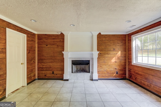 476 Walnut Rd, Hoschton, GA 30548 - unfurnished living room with wood walls, a fireplace, a textured ceiling, and recessed lighting