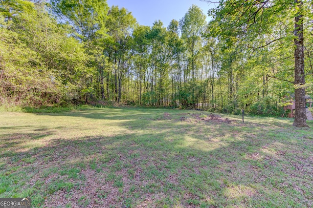 476 Walnut Rd, Hoschton, GA 30548 - view of grassy yard featuring a forest view