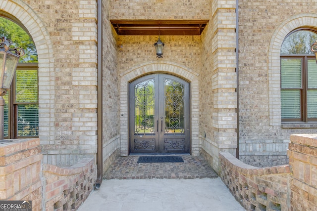 476 Walnut Rd, Hoschton, GA 30548 - doorway to property featuring french doors and brick siding