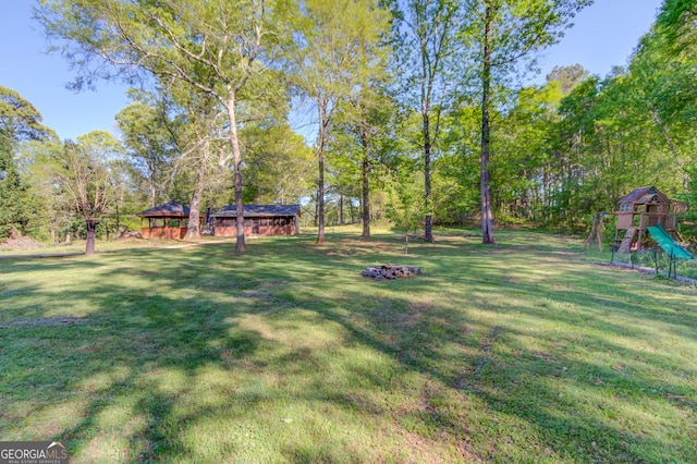 476 Walnut Rd, Hoschton, GA 30548 - view of green lawn featuring a playground