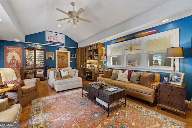 living room with wood finished floors, a ceiling fan, lofted ceiling, and recessed lighting