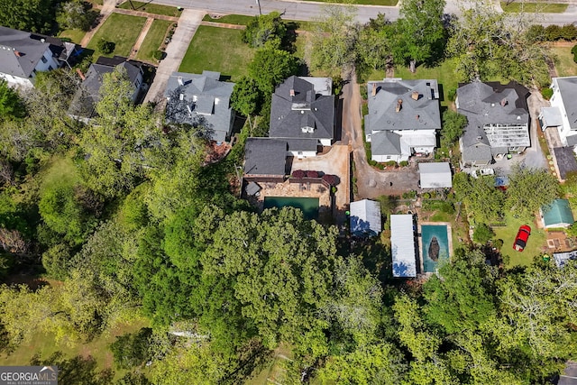 birds eye view of property with a residential view