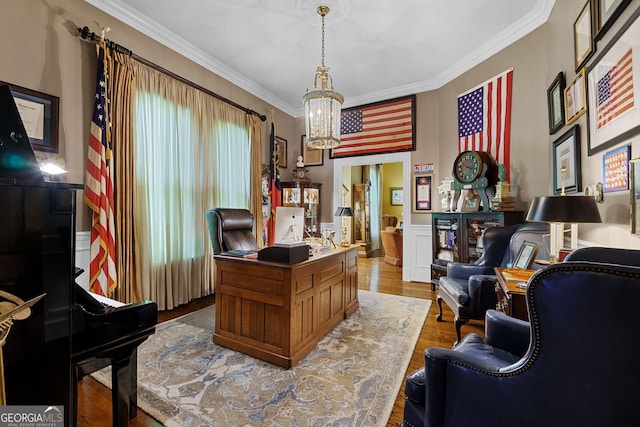 office area featuring crown molding, wainscoting, an inviting chandelier, and wood finished floors