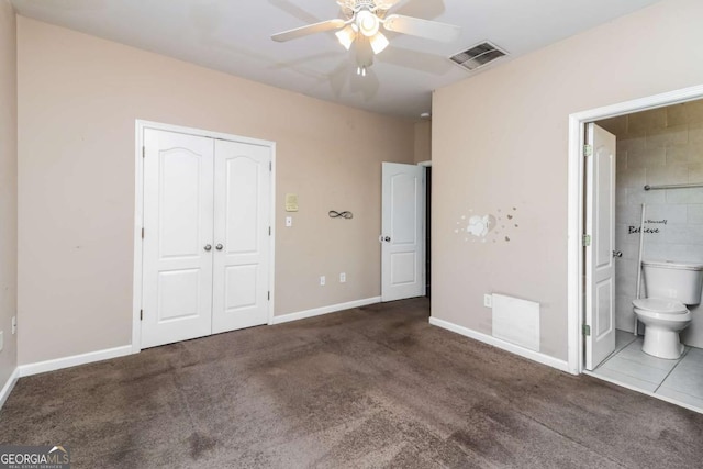 unfurnished bedroom with a closet, baseboards, visible vents, and carpet floors