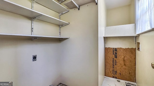 washroom featuring electric dryer hookup and laundry area