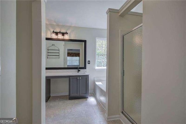 full bathroom featuring a shower stall, vanity, and a garden tub