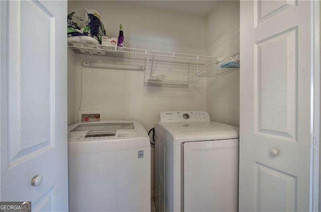 laundry area featuring laundry area and washer and clothes dryer