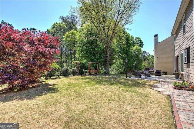 view of yard with a patio area