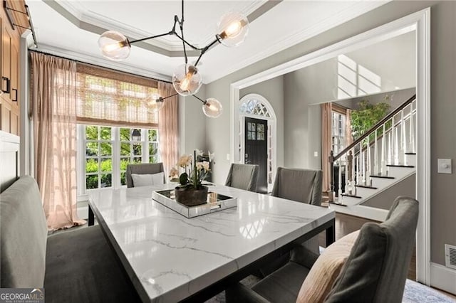 3749 Watkins Pl NE, Brookhaven, GA 30319 - dining room with crown molding, stairway, a chandelier, and a raised ceiling