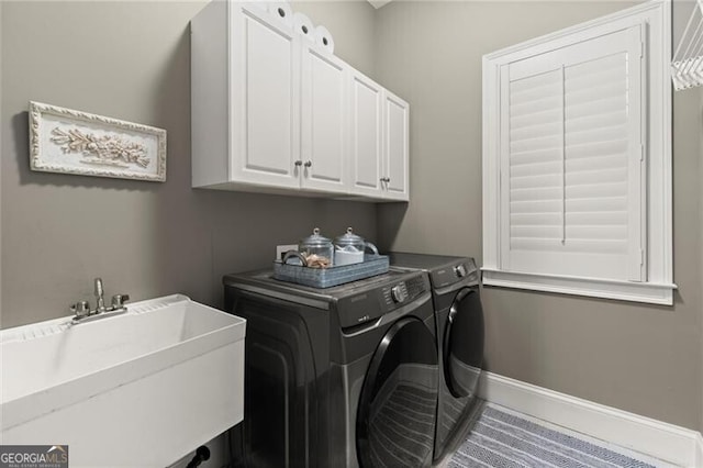 3749 Watkins Pl NE, Brookhaven, GA 30319 - laundry room with independent washer and dryer, cabinet space, and baseboards