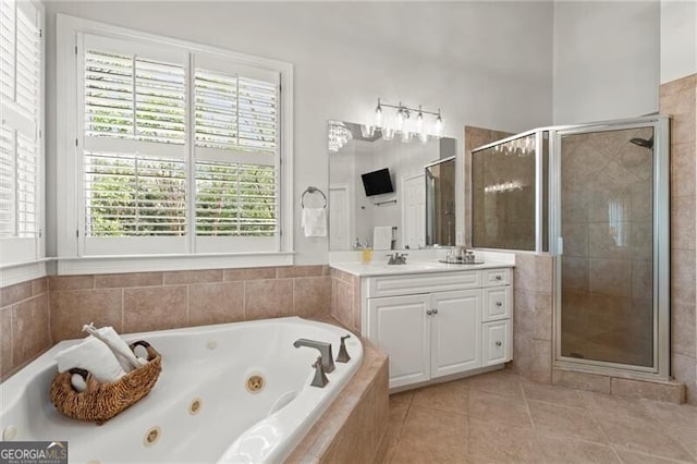 3749 Watkins Pl NE, Brookhaven, GA 30319 - full bath with vanity, a jetted tub, a stall shower, and tile patterned flooring