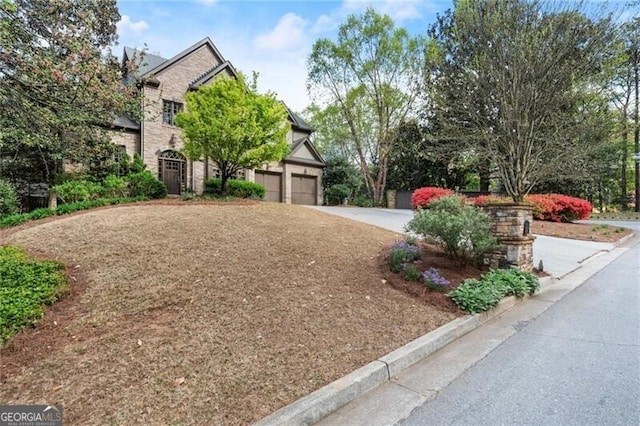 3749 Watkins Pl NE, Brookhaven, GA 30319 - view of front of house with driveway and an attached garage