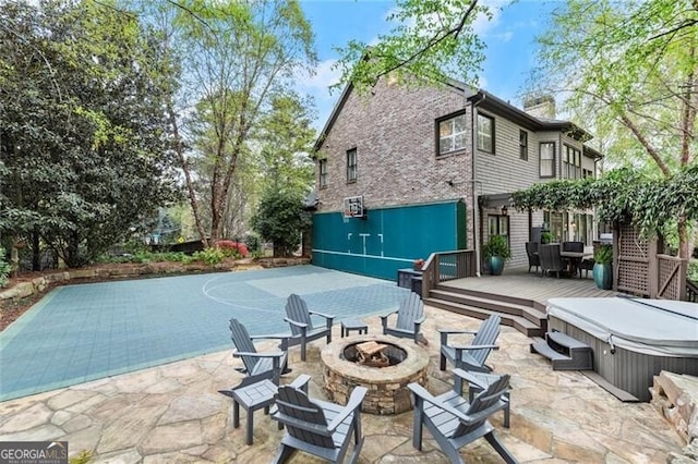 3749 Watkins Pl NE, Brookhaven, GA 30319 - view of patio with an outdoor fire pit, a hot tub, and a wooden deck