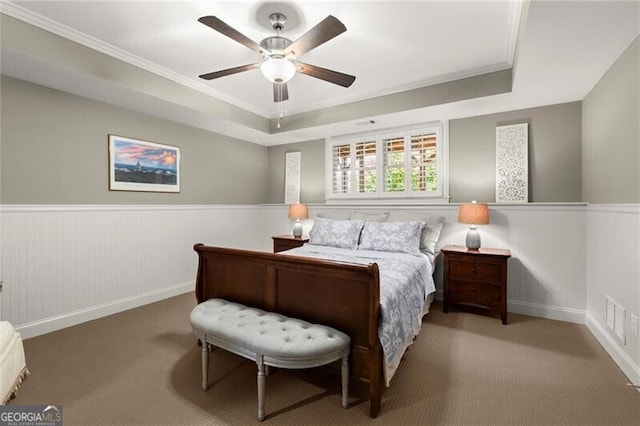 3749 Watkins Pl NE, Brookhaven, GA 30319 - bedroom featuring carpet floors, a wainscoted wall, crown molding, a tray ceiling, and ceiling fan