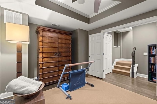 3749 Watkins Pl NE, Brookhaven, GA 30319 - office area featuring wood finished floors, baseboards, ornamental molding, ceiling fan, and a tray ceiling