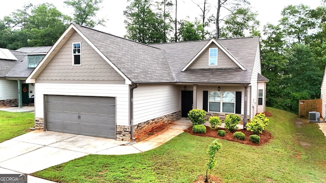 349 Park Blvd W, Athens, GA 30606 - view of front of home with stone siding, a front yard, concrete driveway, and a shingled roof
