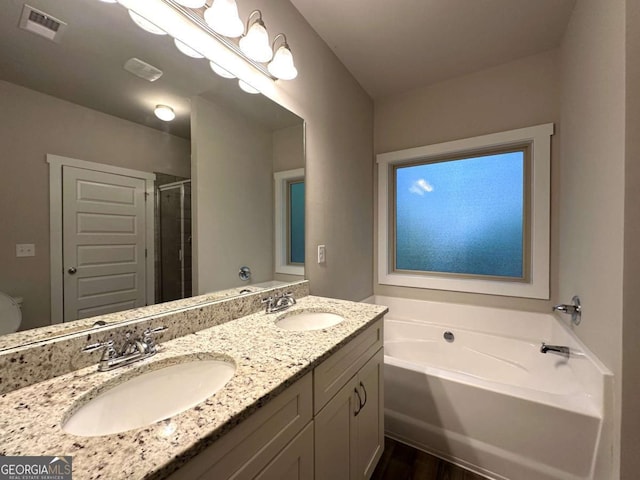 349 Park Blvd W, Athens, GA 30606 - full bath with a garden tub, a shower stall, double vanity, and wood finished floors
