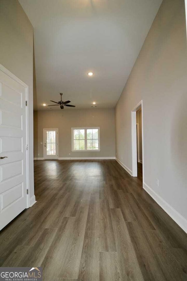 spare room featuring baseboards, recessed lighting, ceiling fan, and wood finished floors
