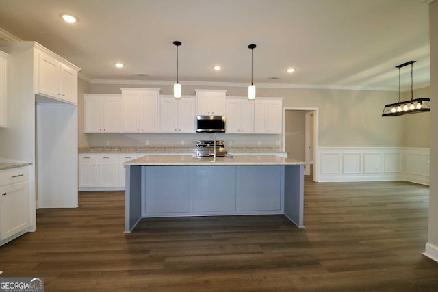 kitchen featuring white cabinets, dark wood-style floors, and appliances with stainless steel finishes