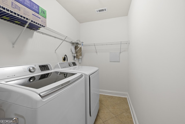 503 Madison Ct Unit 503, Smyrna, GA 30080 - laundry area with baseboards, light tile patterned floors, visible vents, laundry area, and washer and dryer