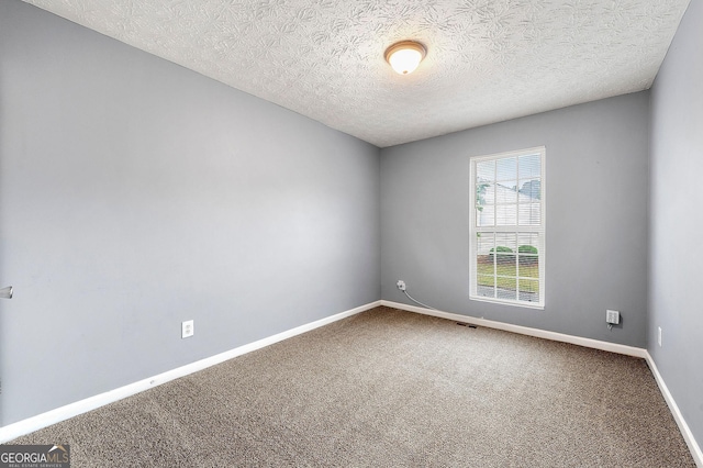 4413 Pinscher St, Union City, GA 30291 - spare room with baseboards, a textured ceiling, carpet, and visible vents